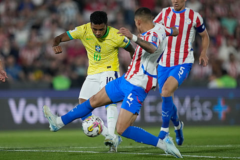 2026 FIFA World Cup Qualifying, Brazil vs Paraguay: Brazil's Rodrygo, left, and Paraguay's Juan Caceres battle for the ball 
